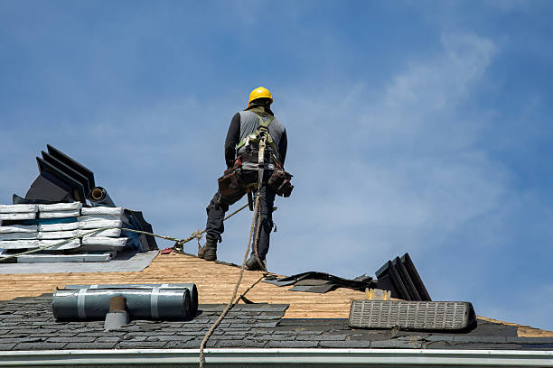 Professional Roof Replacement technician working in Wellesley, MA